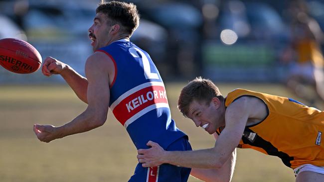 EDFL: Keilor’s Todd Stevenson can’t escape Strathmore’s Lachlan Currie. Picture: Andy Brownbill