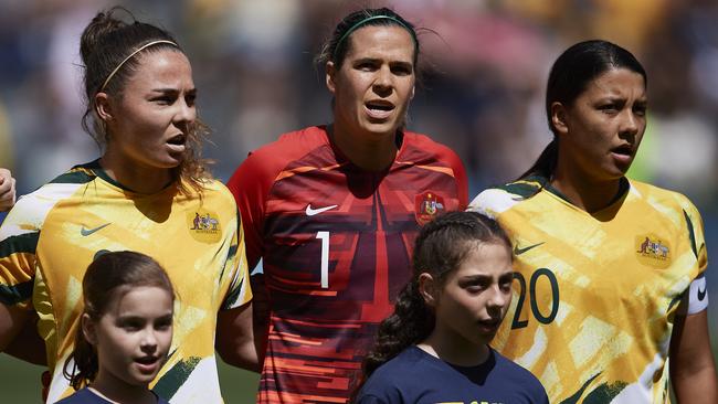 Matildas Jenna McCormick, Lydia Williams and Sam Kerr stand for the anthem before the international friendly match against Chile at Bankwest Stadium in Sydney on November 9. Picture: Brett Hemmings/Getty Images