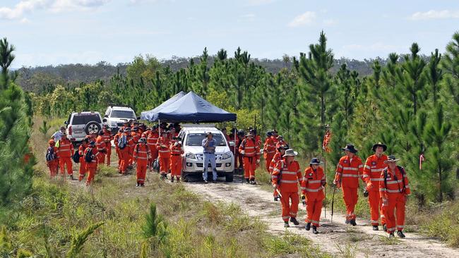 Inspector Brett long and SES volunteers sweep the Toolara State Forest near Tin Can Bay. Picture: Patrick Woods / The Gympie Times