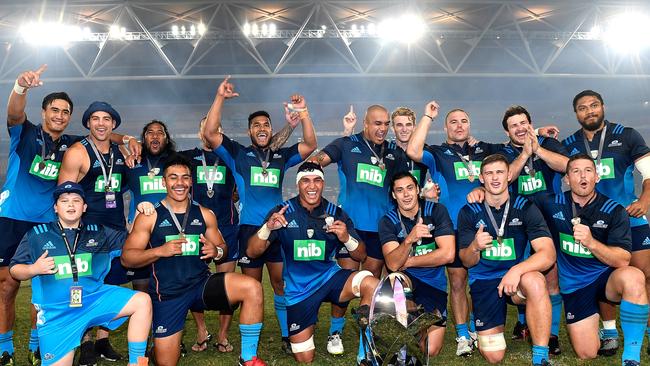 The Blues celebrate victory after defeating the Hurricanes at Suncorp Stadium.