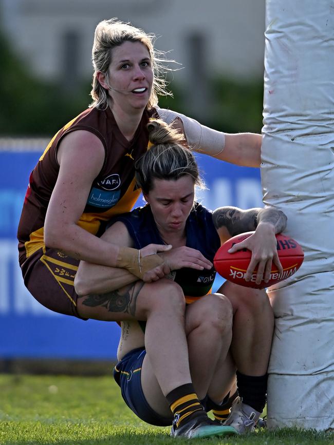 VAFA: St Kevin’s Emma Lynch and Kew’s Tara Donnan run into the a post. Picture: Andy Brownbill