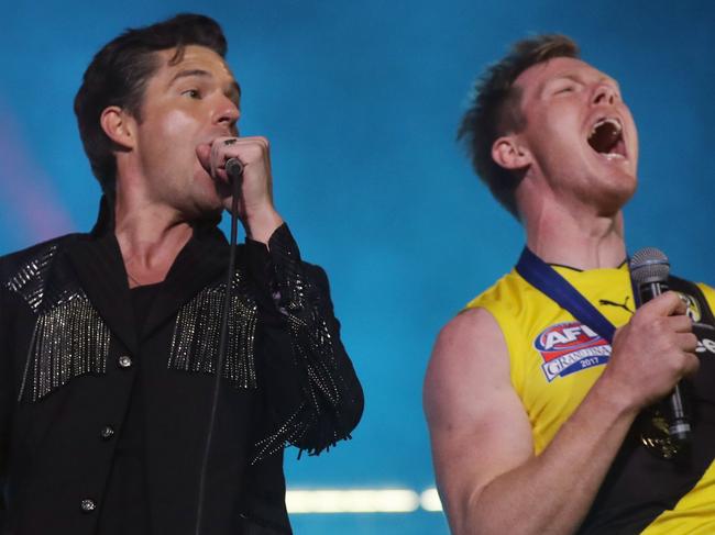 The 2017 AFL Grand Final between the Adelaide Crows and Richmond Tigers at the Melbourne Cricket Ground. The Killers lead singer Brandon Flowers with Jack Riewoldt.    Picture: Alex Coppel.