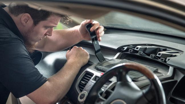 Technicians work to replace Takata airbags.