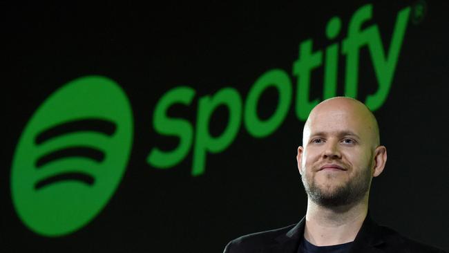 Daniel Ek, CEO of Swedish music streaming service Spotify, poses for photographers at a press conference in Tokyo on September 29, 2016.