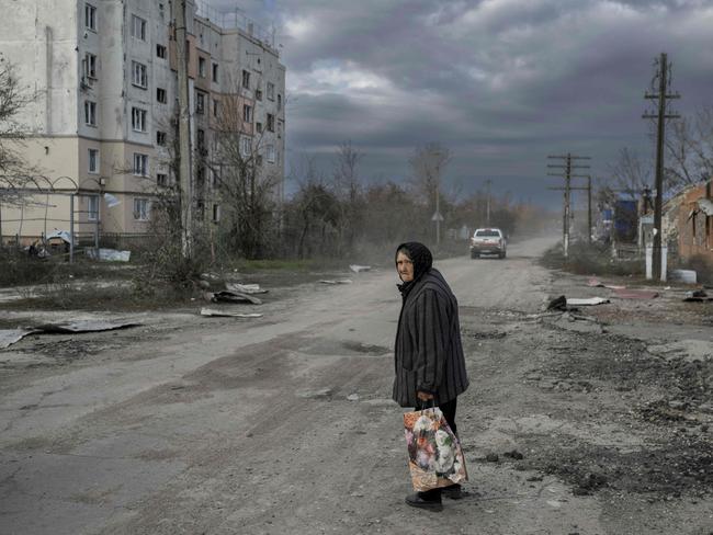 A woman walks in the Kherson region village of Arkhanhelske. Picture: Bulent Kilic/ AFP.