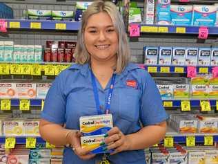 TAKE CARE: Chemist Warehouse staff member Georgia Wheat recommends products when you're feeling ill. Picture: Rhylea Millar