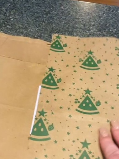 The Woolies bag was transformed into wrapping paper. Picture: TikTok/Shantelle Conway