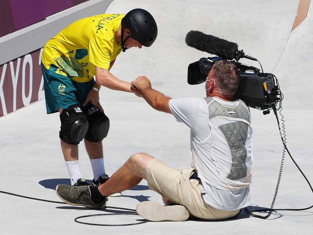 Spectators warmed to Woolley after he offered the cameraman a fist pump and helped him to get up – all with a cheeky grin. Picture: Getty Images