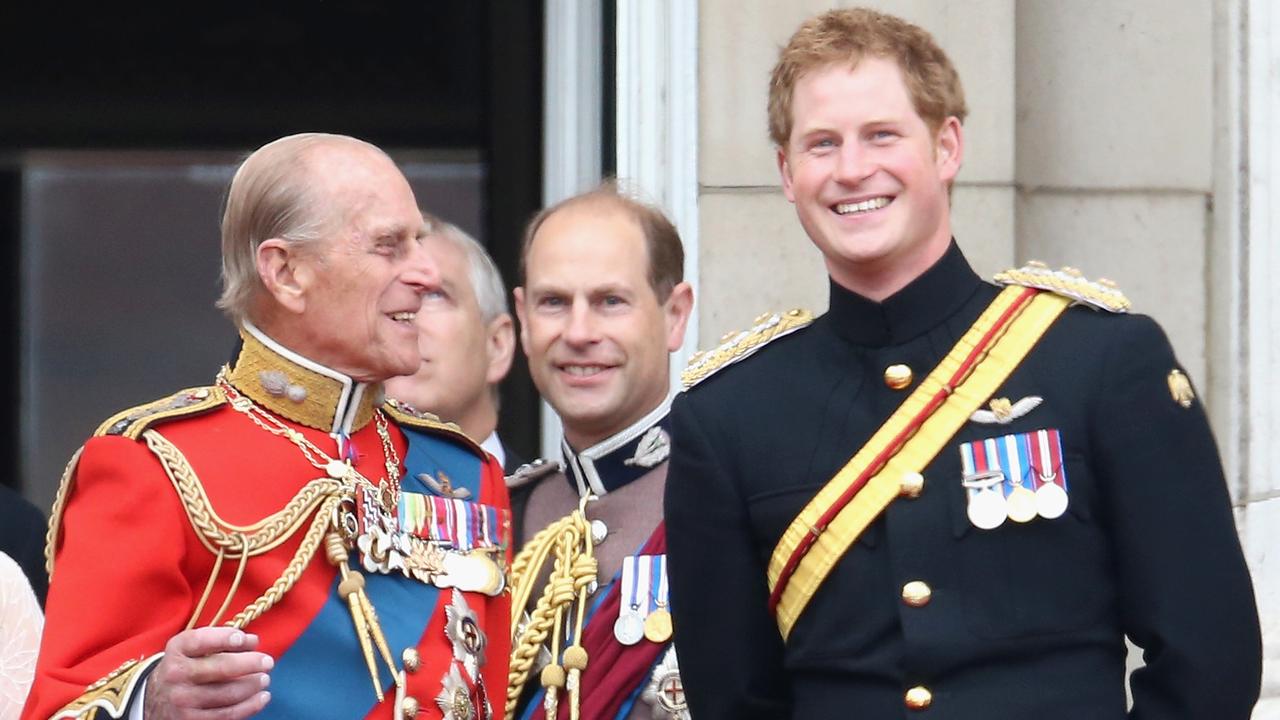 Prince Harry and Prince Philip share a joke on the balcony during Queen Elizabeth II’s Birthday Parade in 2014. Picture: Chris Jackson/Getty Images