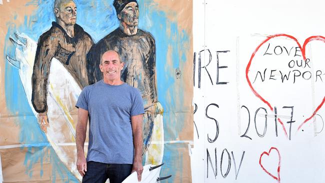 Newport surfer Nick Carroll poses next to the portrait of him and brother Tom Carroll by artist Christina Ambrose-Keyes, at Mona Vale in 2017. Picture: Troy Snook.