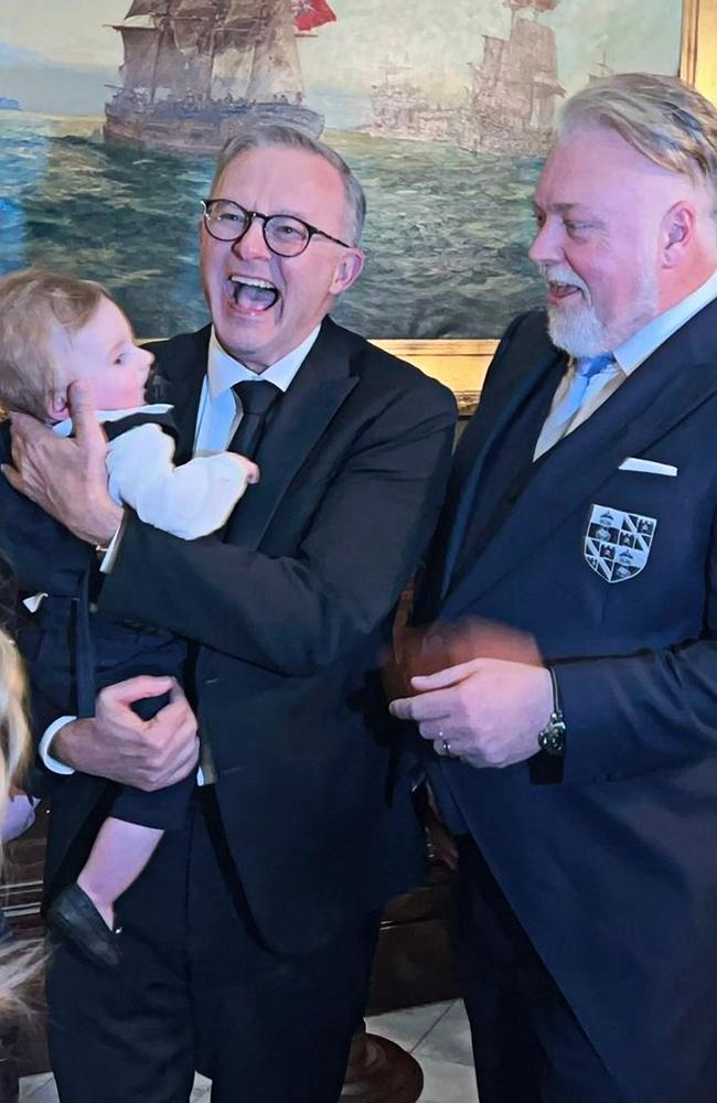 Albo holding Kyle's son Otto during the shock jock’s wedding to Tegan Kynaston, where former gangland figure John Ibrahim and convicted drug smuggler Simon Main were groomsmen. Picture: Twitter