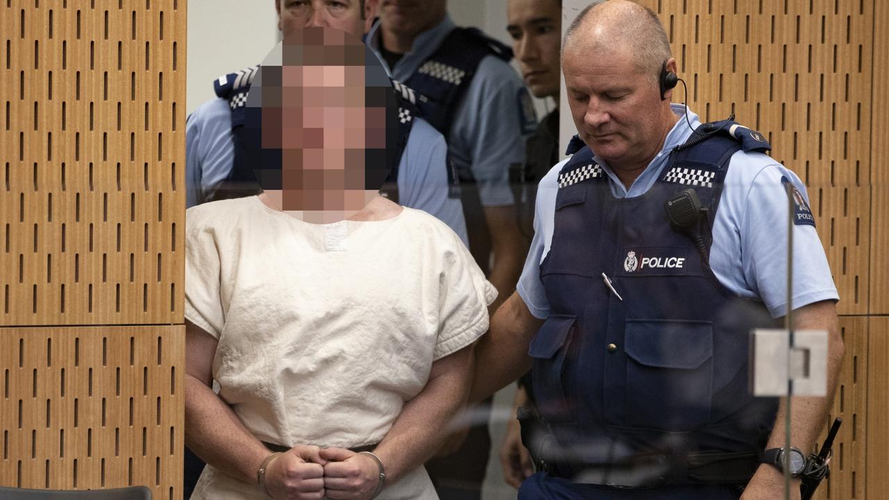 Brenton Tarrant is lead into the dock for his appearance. Picture: Mark Mitchell/NZ Herald 