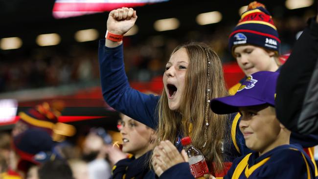 Crows fans celebrate the win over Carlton in the first Gather Round game at Adelaide Oval. Picture: Phil Hillyard