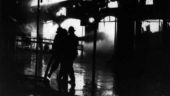 Firemen at the scene of of the ghost train fire that killed six children and one adult in 1979.