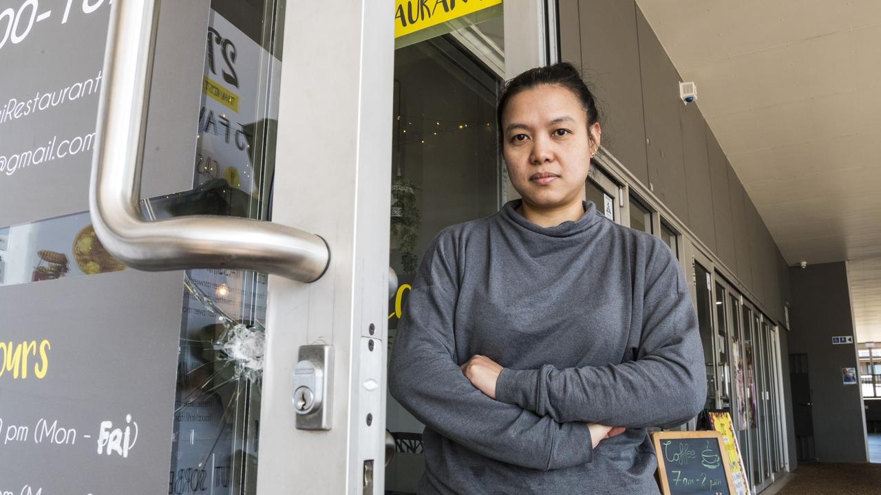 2TG Thai Restaurant owner Om Kasemputtikoom looks over damage to her door after a number of business break-ins at the Red Edge Shopping Centre, Monday, April 19, 2021. Picture: Kevin Farmer