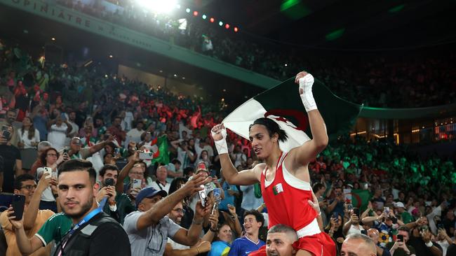 PARIS, FRANCE - AUGUST 09: Imane Khelif of Team Algeria celebrates to the crowd after winning the gold medal following the Boxing Women's 66kg Final match against Liu Yang of Team China on day fourteen of the Olympic Games Paris 2024 at Roland Garros on August 09, 2024 in Paris, France. (Photo by Richard Pelham/Getty Images)