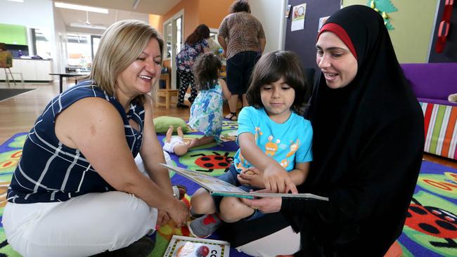 19/11/2015: Community Hub leader Fahriye Yilmaz with Hanadi El Rayes and her 4-year-old son Ibrahim at Coolaroo South Primary School playgroup in Melbournes north . David Geraghty / The Australian