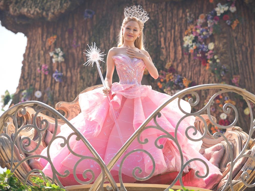 Ariana Grande’s Glinda is perky and perpetually clad in pink.