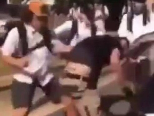 Video shared online shows the students hitting and punching the man to the ground.