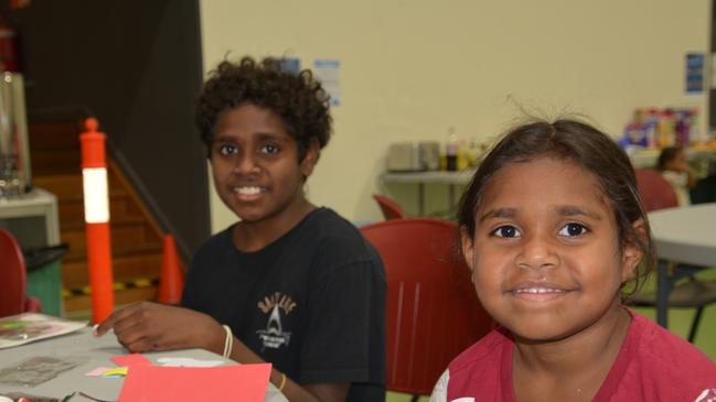 Wujal Wujal residents Lake Solomon, 10, and Iriembul Solomon, 6, at the Cooktown PCYC Evacuation Centre.