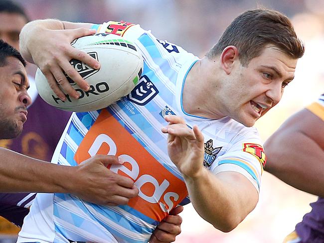 BRISBANE, AUSTRALIA - JUNE 09: Ryley Jacks of the Titans tries to break free during the round 13 NRL match between the Brisbane Broncos and the Gold Coast Titans at Suncorp Stadium on June 09, 2019 in Brisbane, Australia. (Photo by Jono Searle/Getty Images)