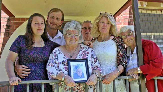 LISMORE TREASURE: At the wake following the memorial service for Geraldine Nicholson, 95, her family shared memories of this much-love lady. L-R Granddaughter Teegan Knight, her partner Stephen Aleckson, daughters Kaye Martin (holding photo of Geraldine) and  Robyn Knight and cousin Phyllis Nicholson, with her husband Brian at the back. Picture: Alison Paterson