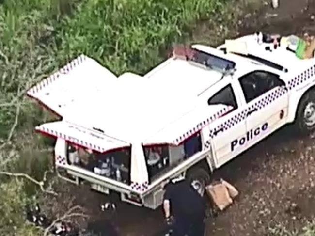 Police in bushland at Preston where the man's body was found. Picture: Nine News Queensland