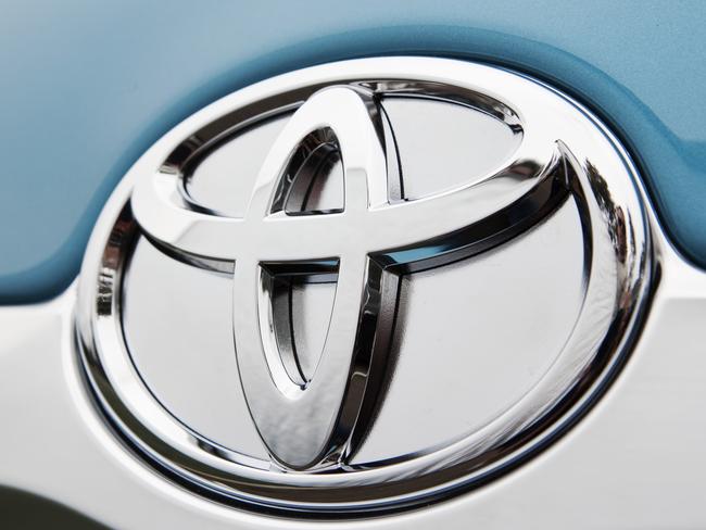 Badge on the 2010 Toyota Camry Hybrid Luxury sedan.