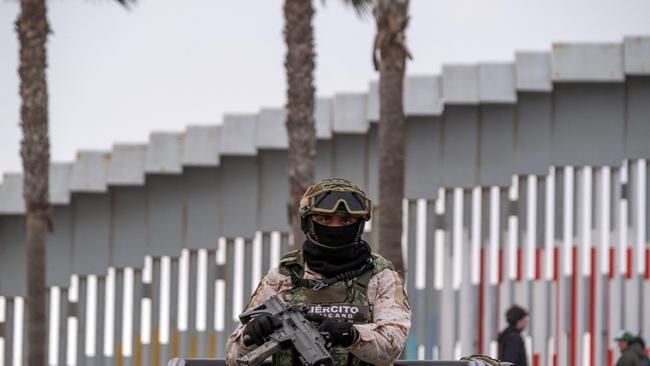 A Mexico's Army officer patrols the Mexican side of the US-Mexico border in Playas de Tijuana, Baja California state, Mexico. PictureGuillermo Arias / AFP