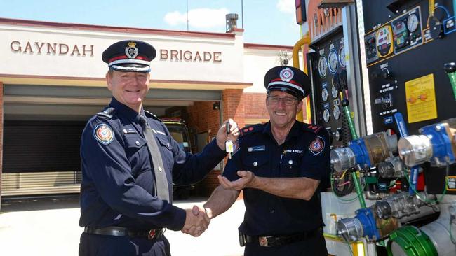 UPGRADE: North Burnett Area Commander Kent Freeman handing the keys of a new fire truck over to Gayndah Fire and Rescue Service Captain Ron Mitchell. Picture: Felicity Ripper