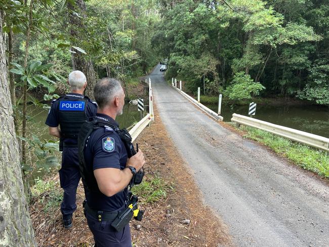 A driver and his passenger made a desperate escape after their car plunged off a bridge at Image Flat and became fully submerged. Photo: Patrick Woods.