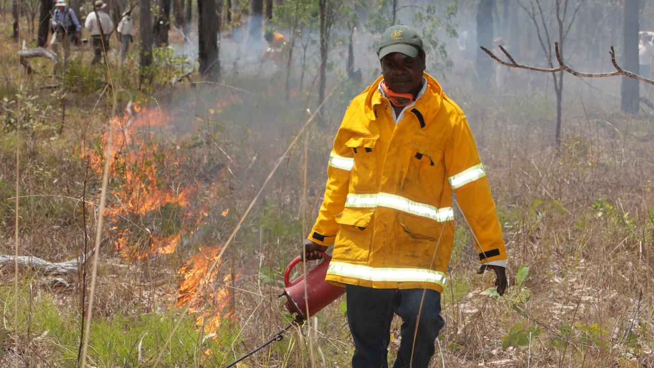 A ranger lays a fire break for traditional management of country in the Northern Territory while carrying out controlled burning to reduce weeds and help preserve native animals. Picture: Supplied