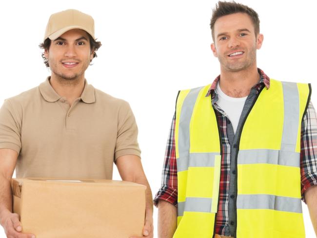 Full length portrait of confident multi-ethnic people with various occupations standing together against white background