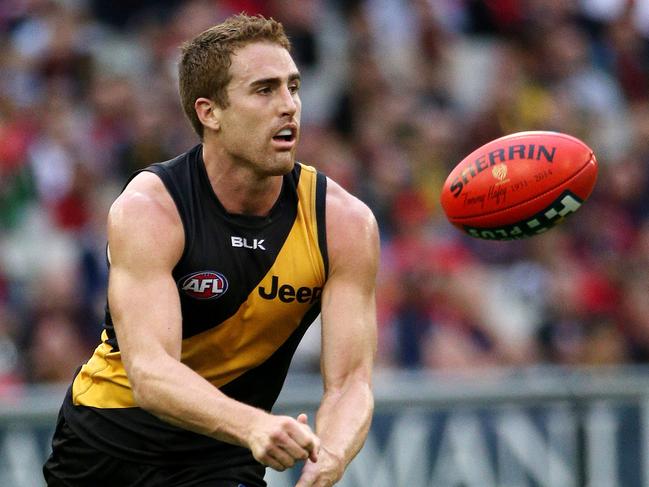 Round 9: Richmond v Melbourne MCG.  Daniel Jackson gets a handpass away. May 17th 2014. Picture : Colleen Petch