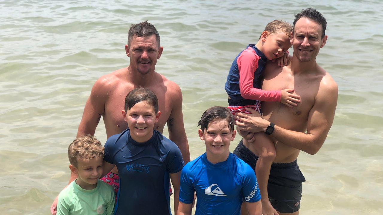 Jude McCullum, Ruben, Howie and Dave Price (back left) enjoy Christmas celebrations with Toby and Darcy McCullum (back right) at Cotton Tree Park. Picture: Laura Pettigrew.