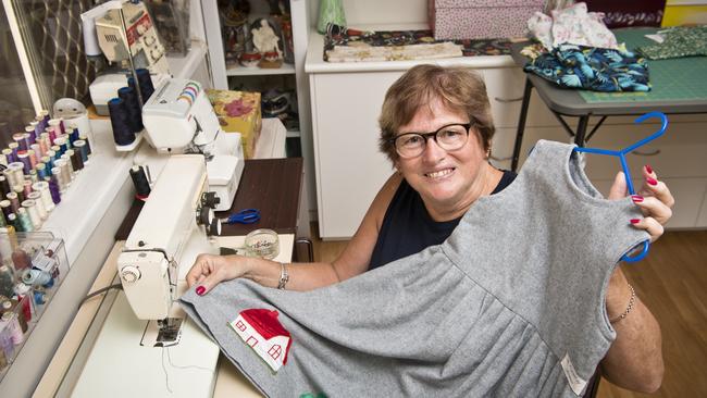 Maryann Bougoure with a dress she made for her daughter 30 years ago. Picture: Kevin Farmer