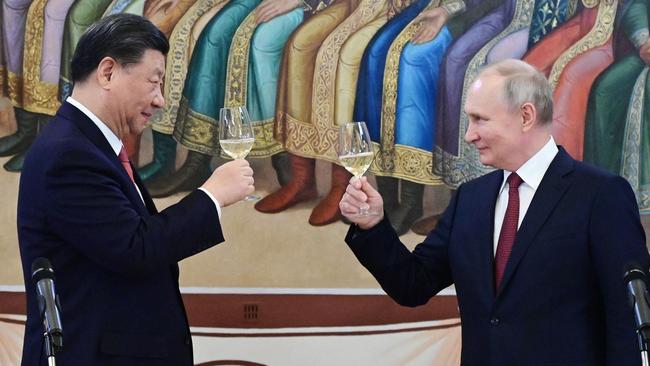 Russian President Vladimir Putin and China's President Xi Jinping make a toast during a reception following their talks at the Kremlin in Moscow in March. Picture: AFP