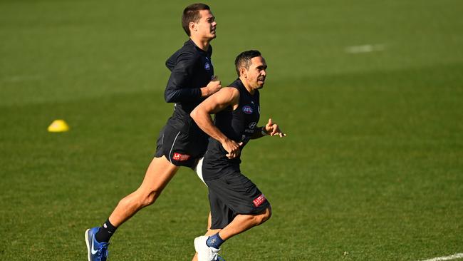 Eddie Betts runs alongside Jack Silvagni at Blues training this week Picture: Getty Images