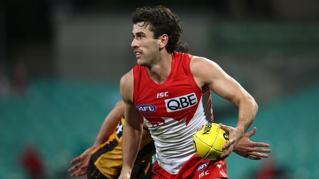 Robbie Fox gathers the ball for the Swans.