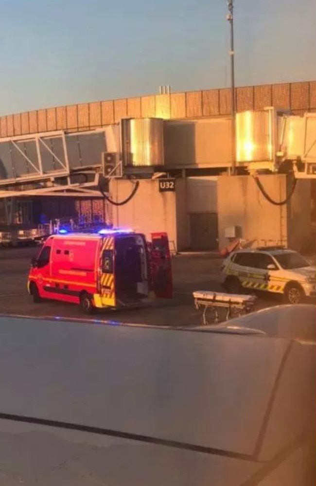 An ambulance waits for a British man at an airport in Toulouse, France, after he suffered a medical emergency on a flight to Ibiza.