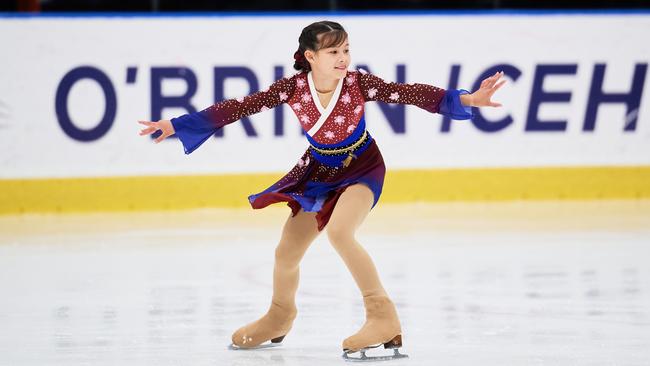 Meili Wu gliding on the ice.