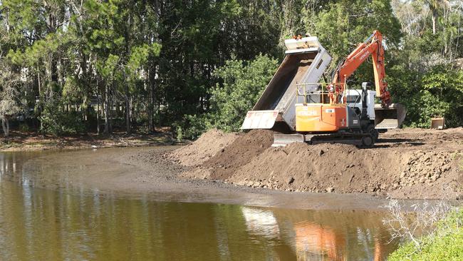 Black Swan Lake slowly being filled in by workmen at Bundall. Picture Glenn Hampson