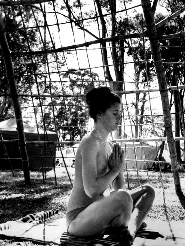 A young woman meditates topless at the Aquarius Festival at Nimbin in 1973. Picture: News Corp NSW