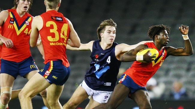 Port Next Generation Academies member Martin Frederick breaks clear of Vic Metro’s Rhylee West during the AFL under-18s match at Etihad Stadium. Picture: Michael Dodge (Getty Images).