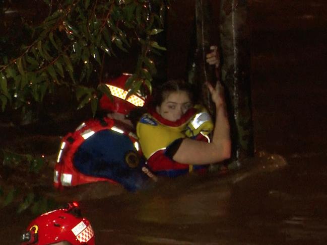 A rescuer jumped into the water and secured her with a rope. Picture: TNV