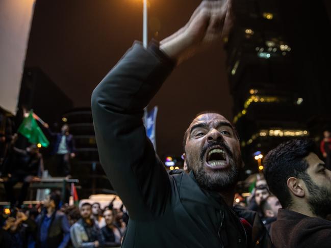 Protesters demonstrate in front of the Israeli consulate after an explosion at the hospital in Gaza.