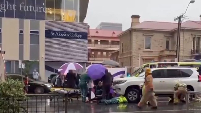 A young girl and woman were rushed to hospital after being hit by a car during peak hour on Angas Street. Picture: 7NEWS