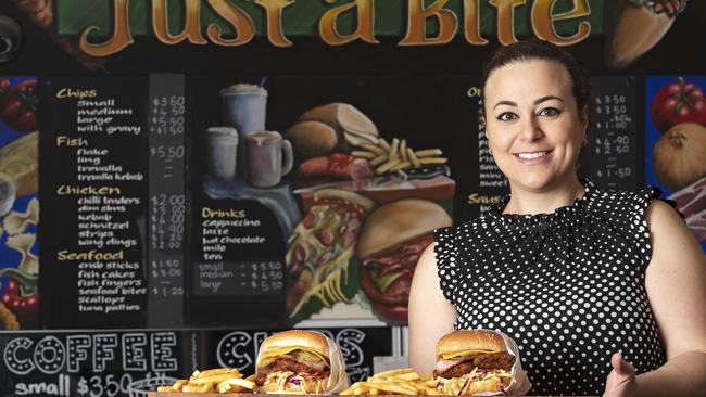 Just a Bite co owner Maria Koumoundouros with crispy fried chicken burgers at North Hobart. Picture: CHRIS KIDD