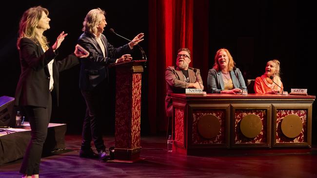 The Advertiser and Sunday Mail journalist Nathan Davies, centre, with RocKwiz hosts Julia Zemiro and Brian Nankervis, and fellow contestants. Picture: Claudio Raschella.