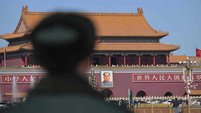 A PLA soldier stands guard before Tiananmen Gate in Beijing ahead of the country's annual legislative meetings known as the ‘Two Sessions. Picture: AFP